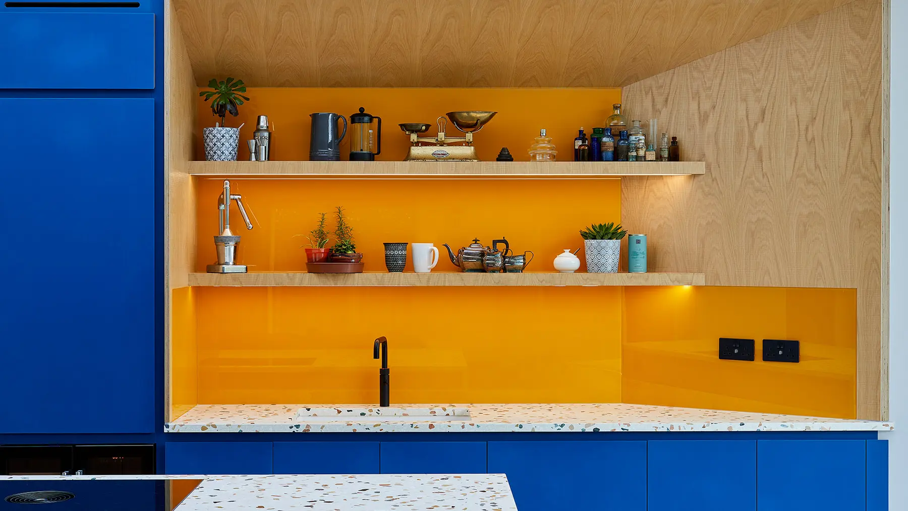 Oak and yellow splashback detail in the kitchen