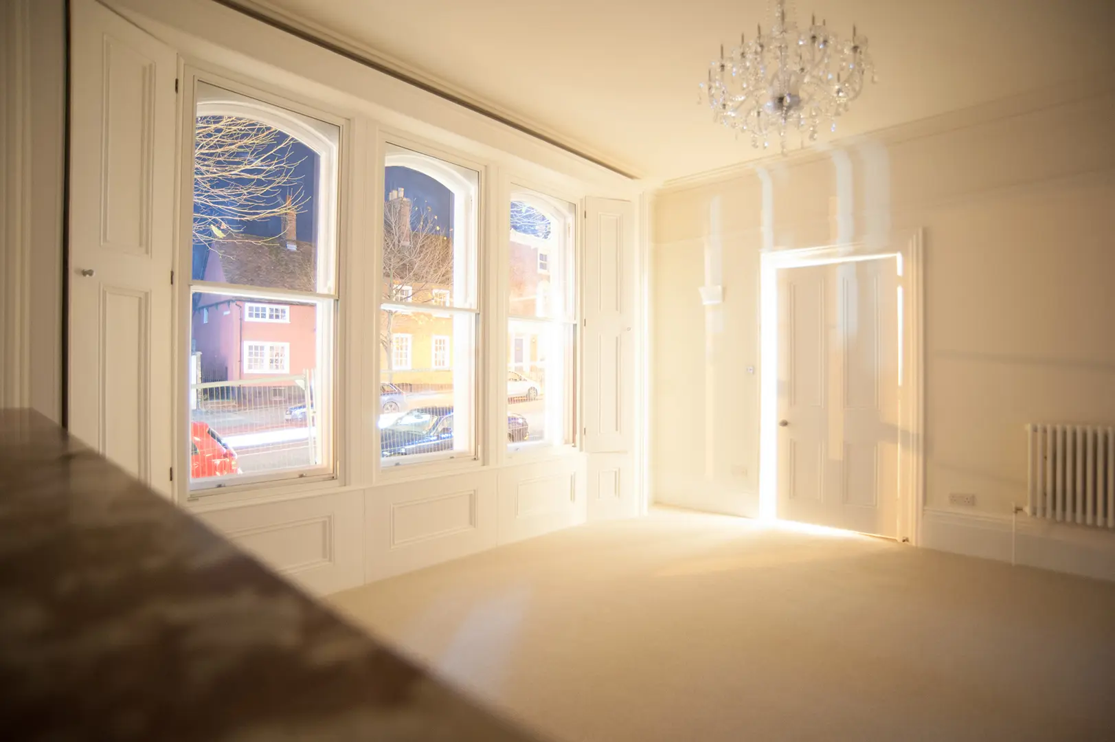 Restored reception room with full-height sash windows