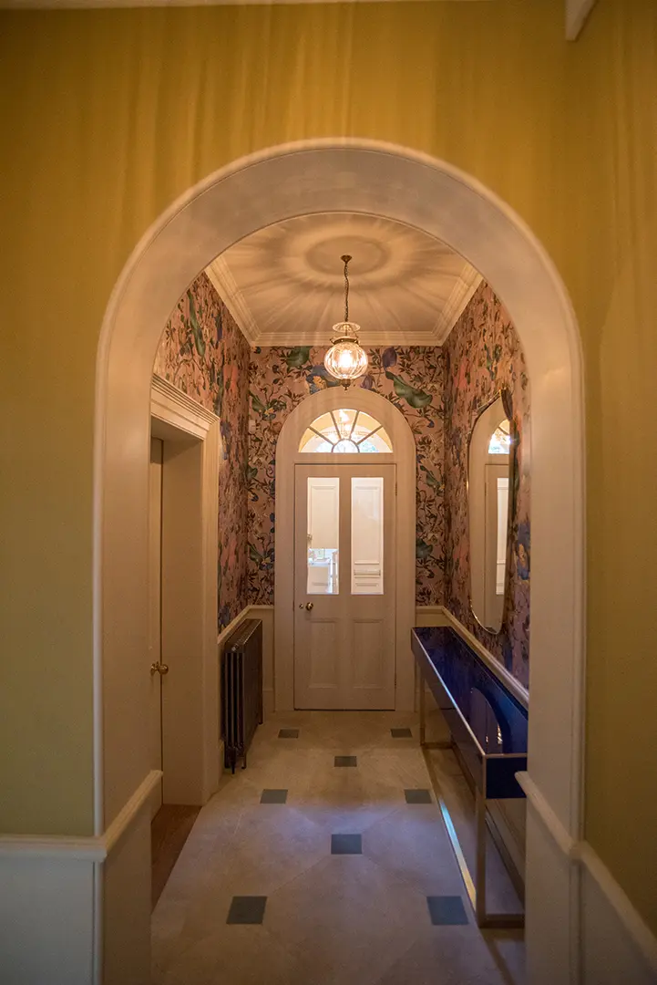 Restored Regency entrance hall with decorative glass and pendant light