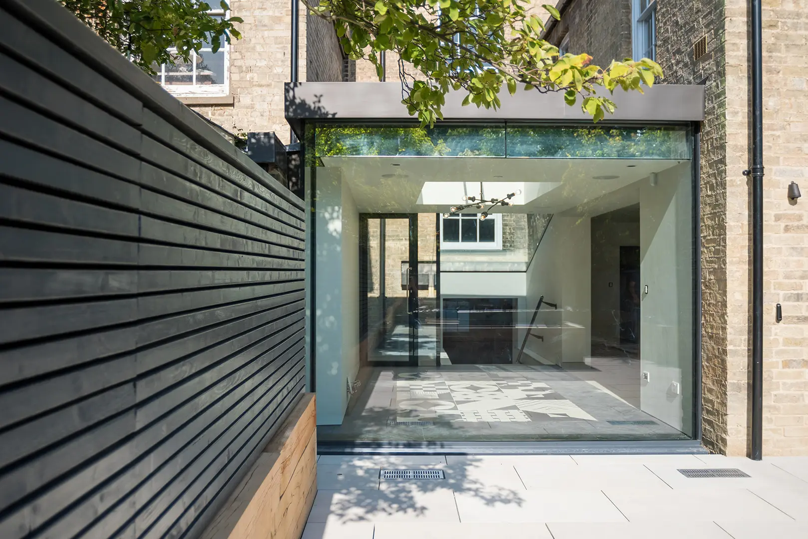 Contemporary glazed rear extension to the listed Cambridge townhouse