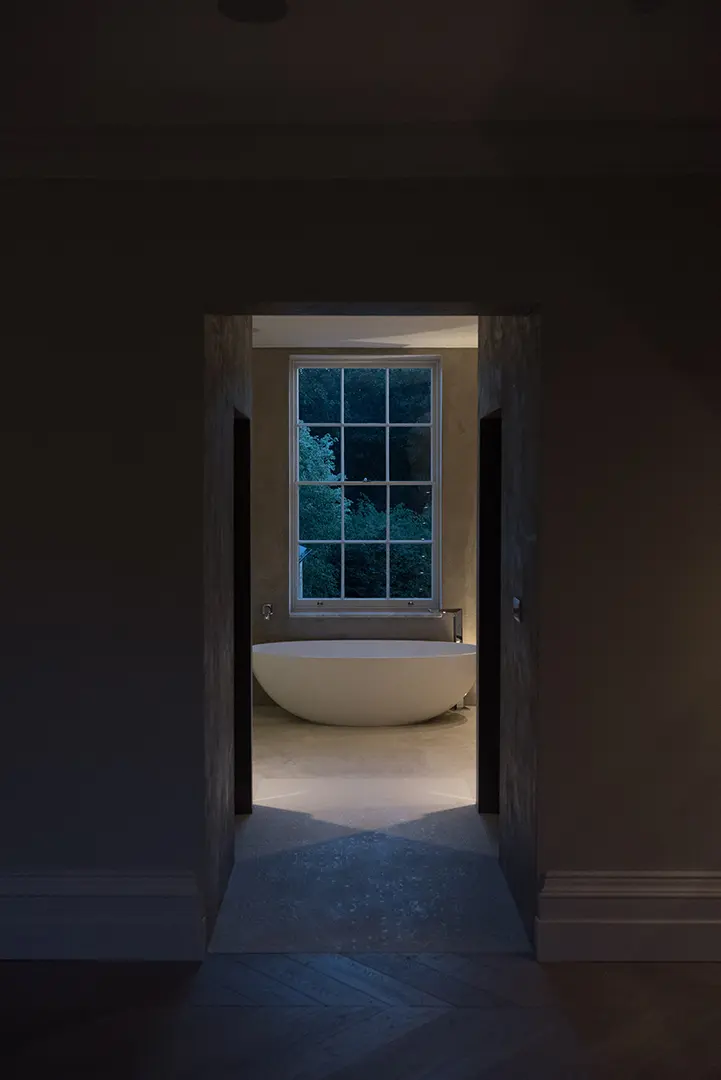 View through the townhouse to a freestanding bath