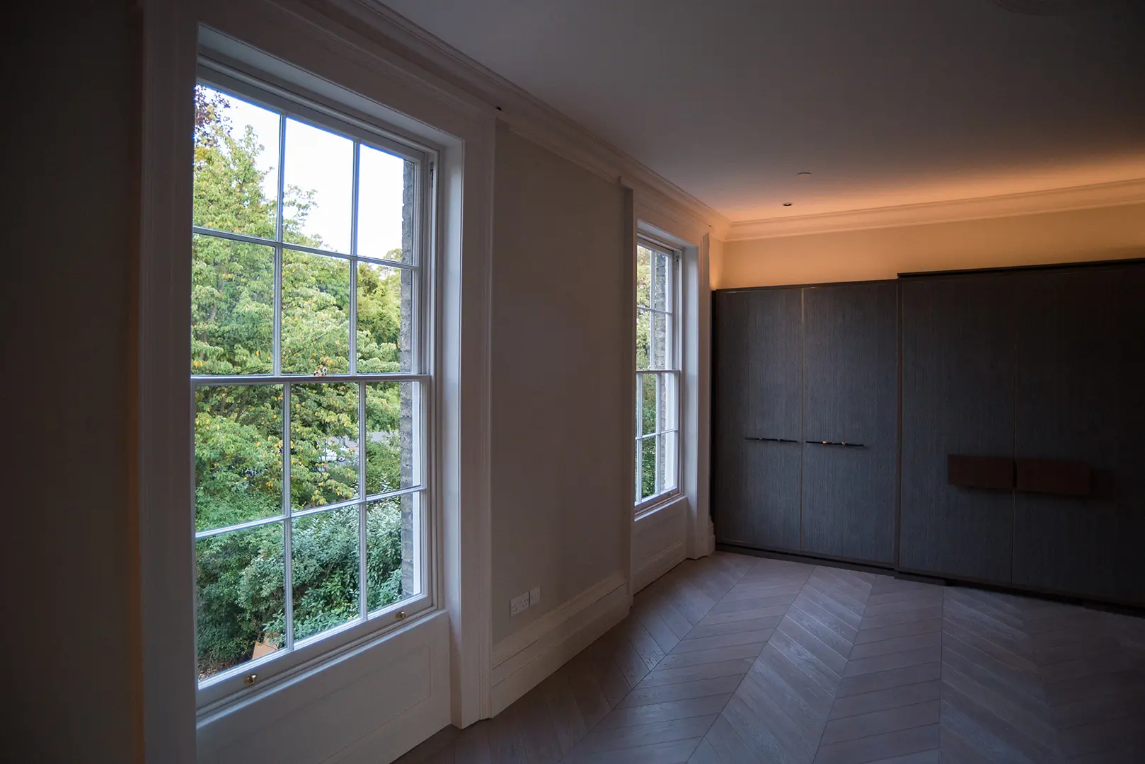 Restored reception room with sash windows and bespoke joinery